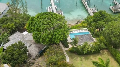 Aerial view of the cottage and pool from above