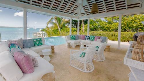 Covered lounge seating by the pool